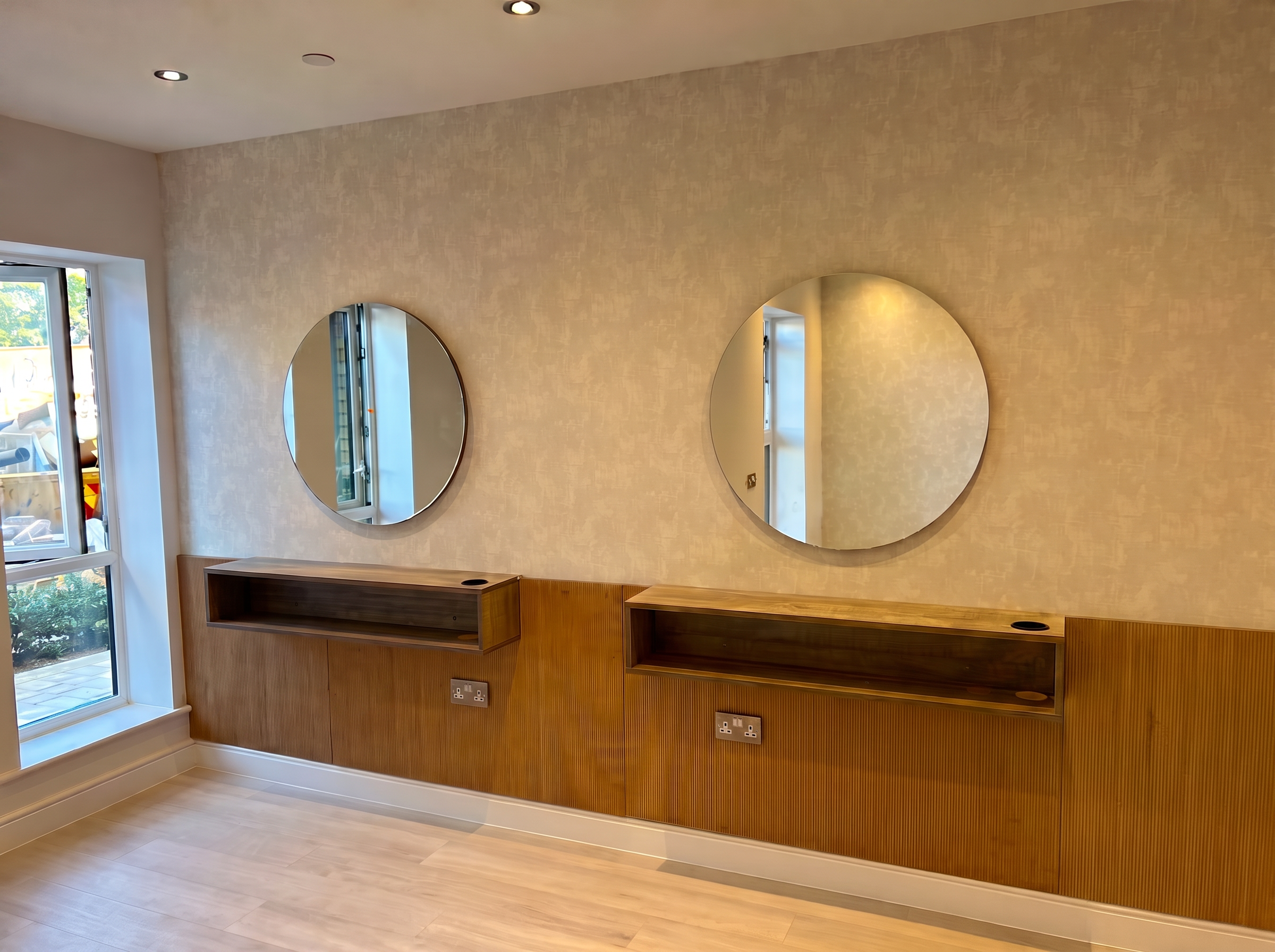 Hairdressing salon fit-out with fluted MDF panelling and fitted styling stations